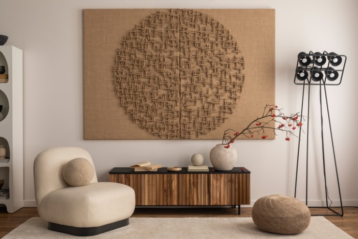 Interior design of living room interior with mock up poster frame, white armchair, wooden sideboard, sculpture, rug, vase with rowan, black modern lamp and personal accessories. Home decor. Template.